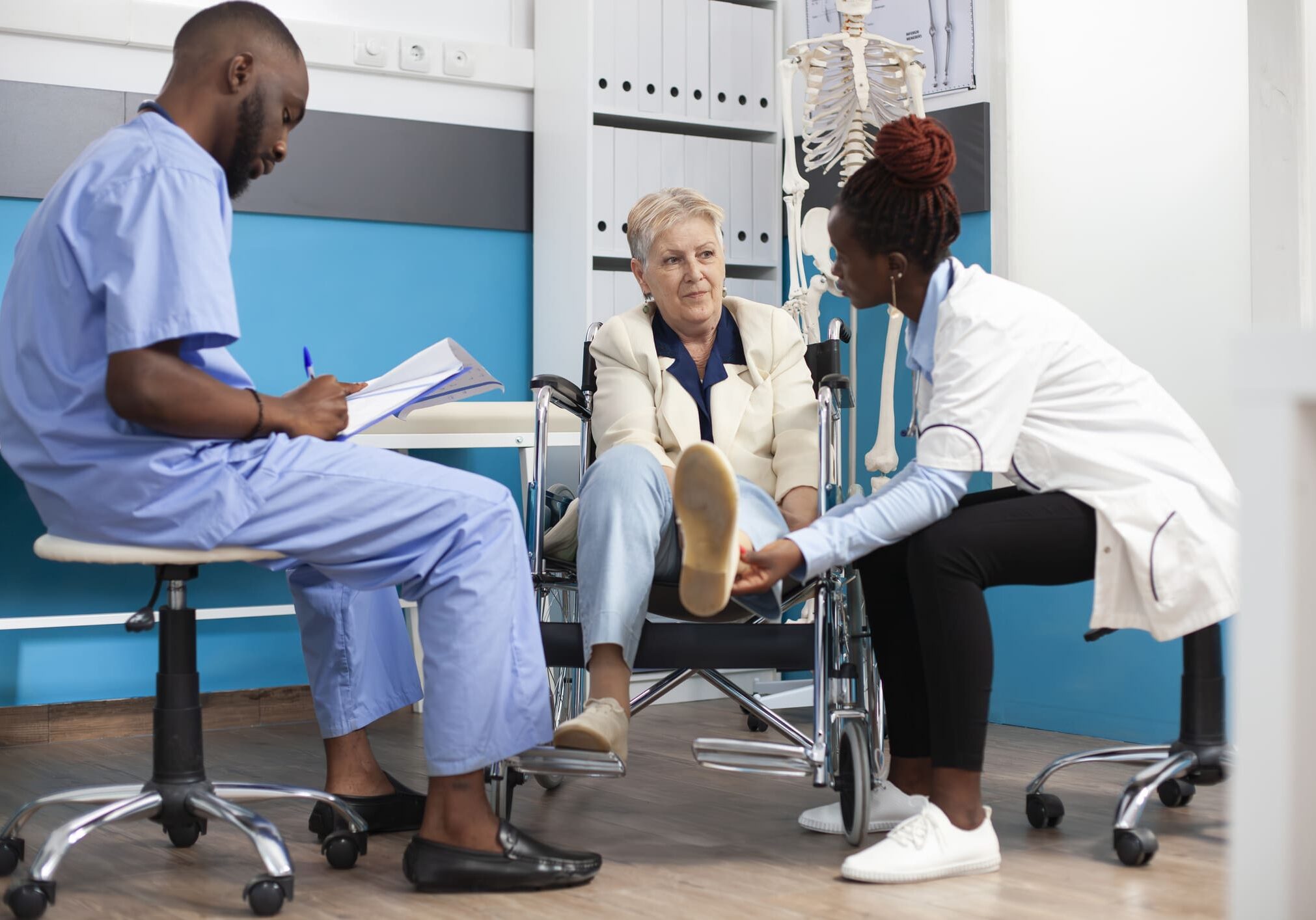 Patient in wheelchair during medical consultation.